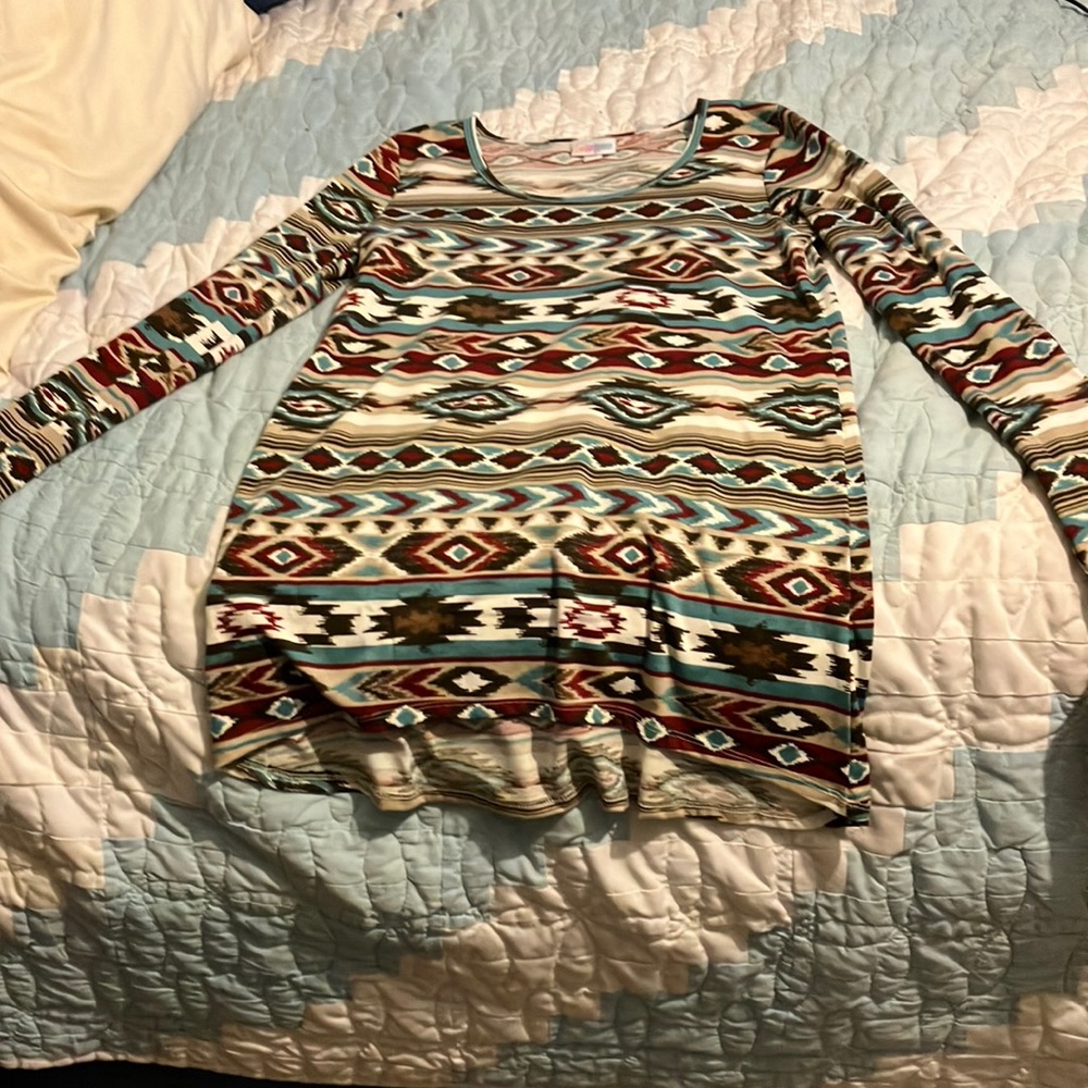 A long sleeve tee-shirt. Size XXS. Western patterns.